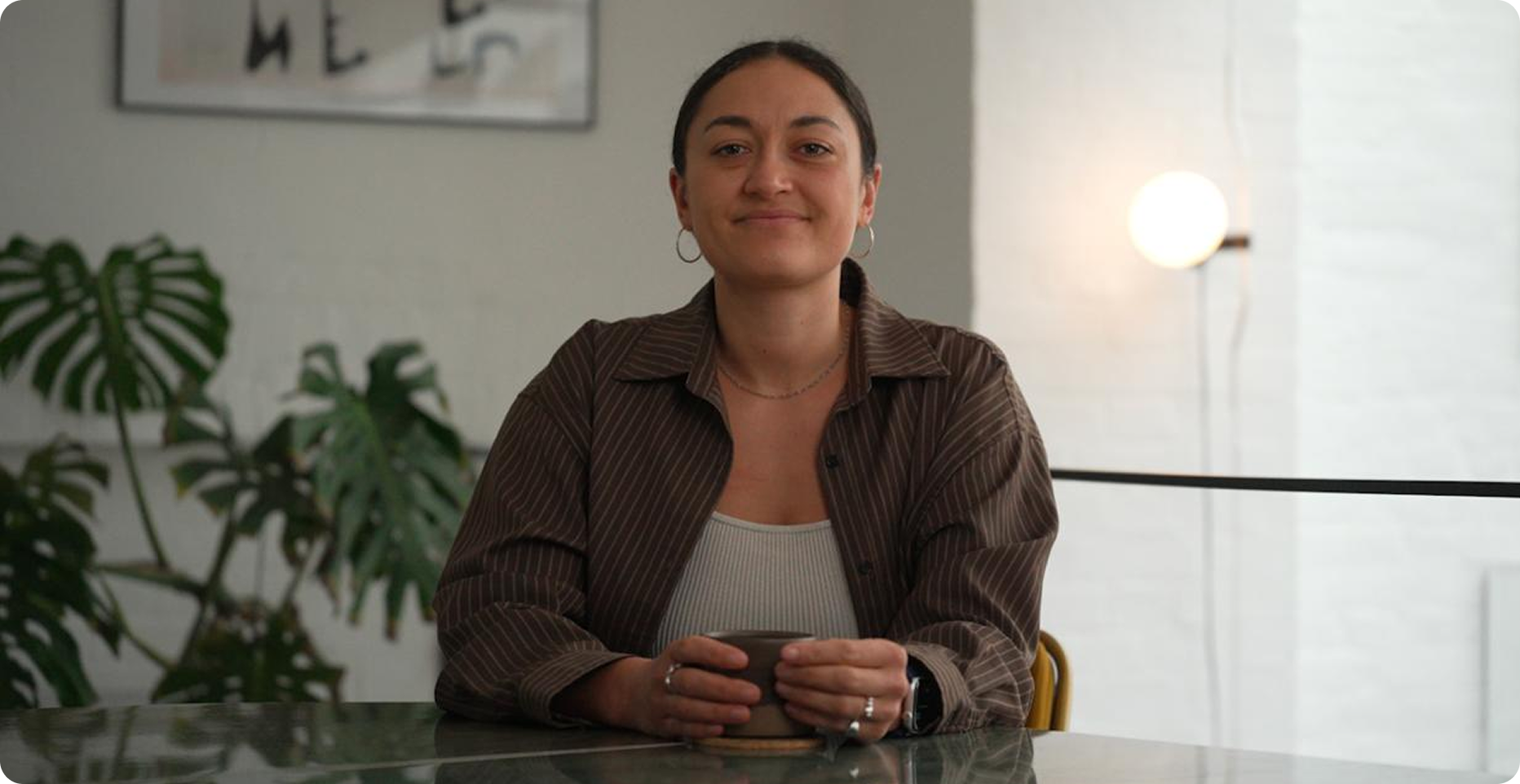 co/co founder speaking to camera at a kitchen table